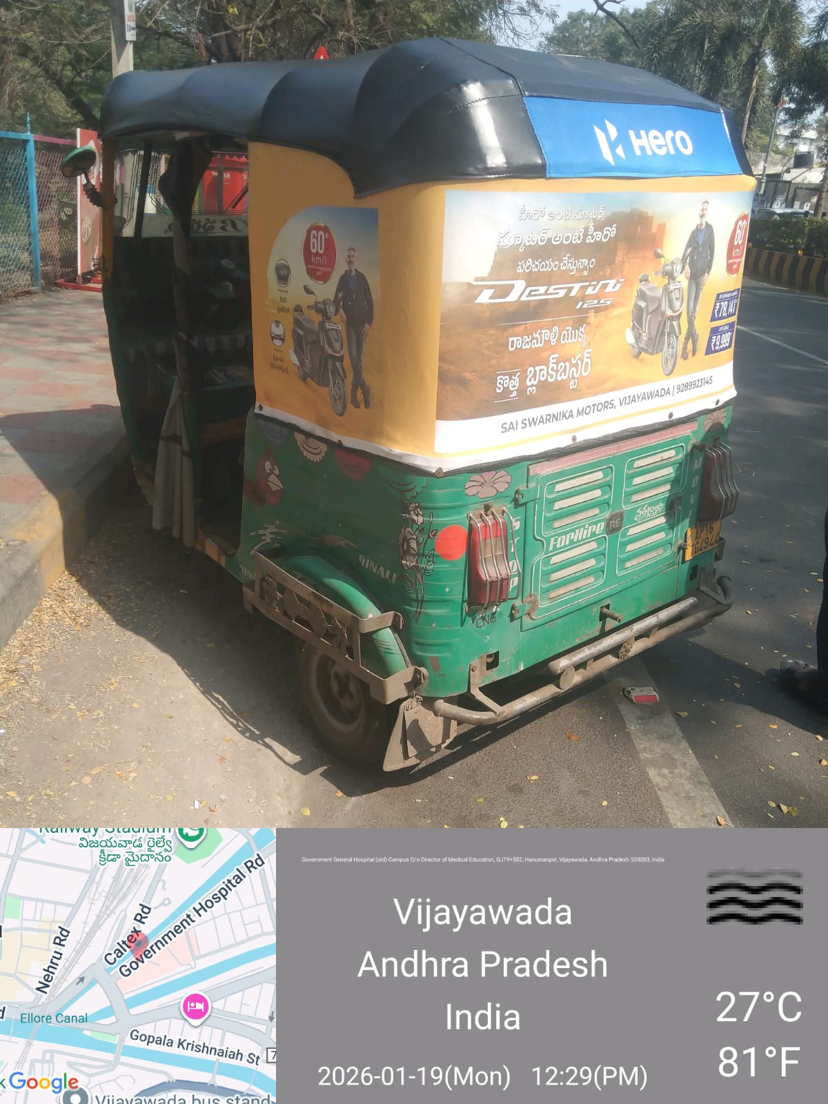 Branded auto rickshaw with Tamil-language hood advertising on a busy T. Nagar shopping street in Chennai