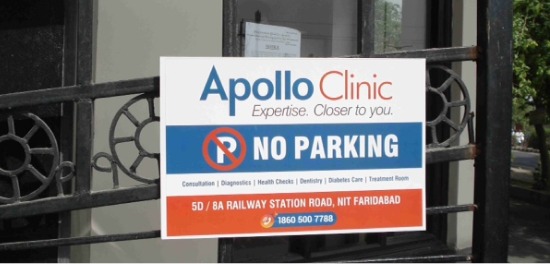No parking board advertising — a branded board fixed to a house or society gate