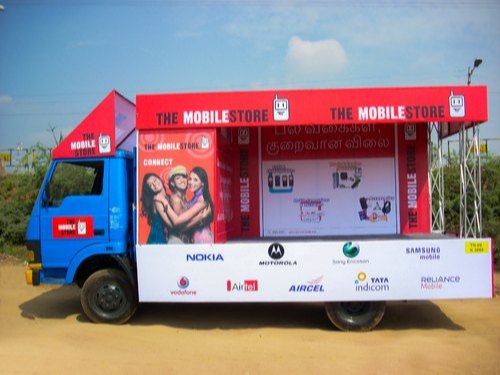 Branded T-Shape advertising van on the HITEC City IT corridor near Cyber Towers in Hyderabad