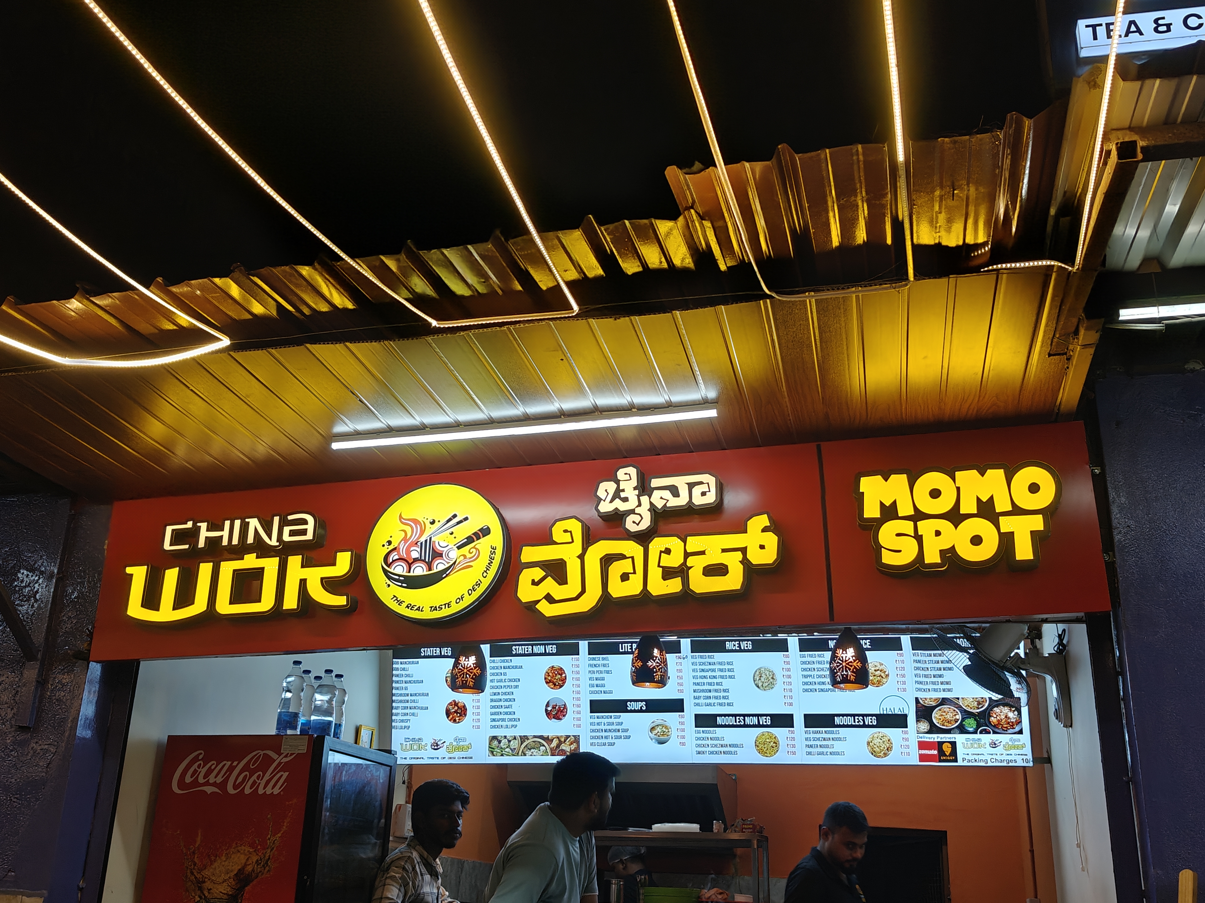 Illuminated ACP and LED shop name board with Bengali lettering on a Kolkata market storefront installed by The Mediaverse