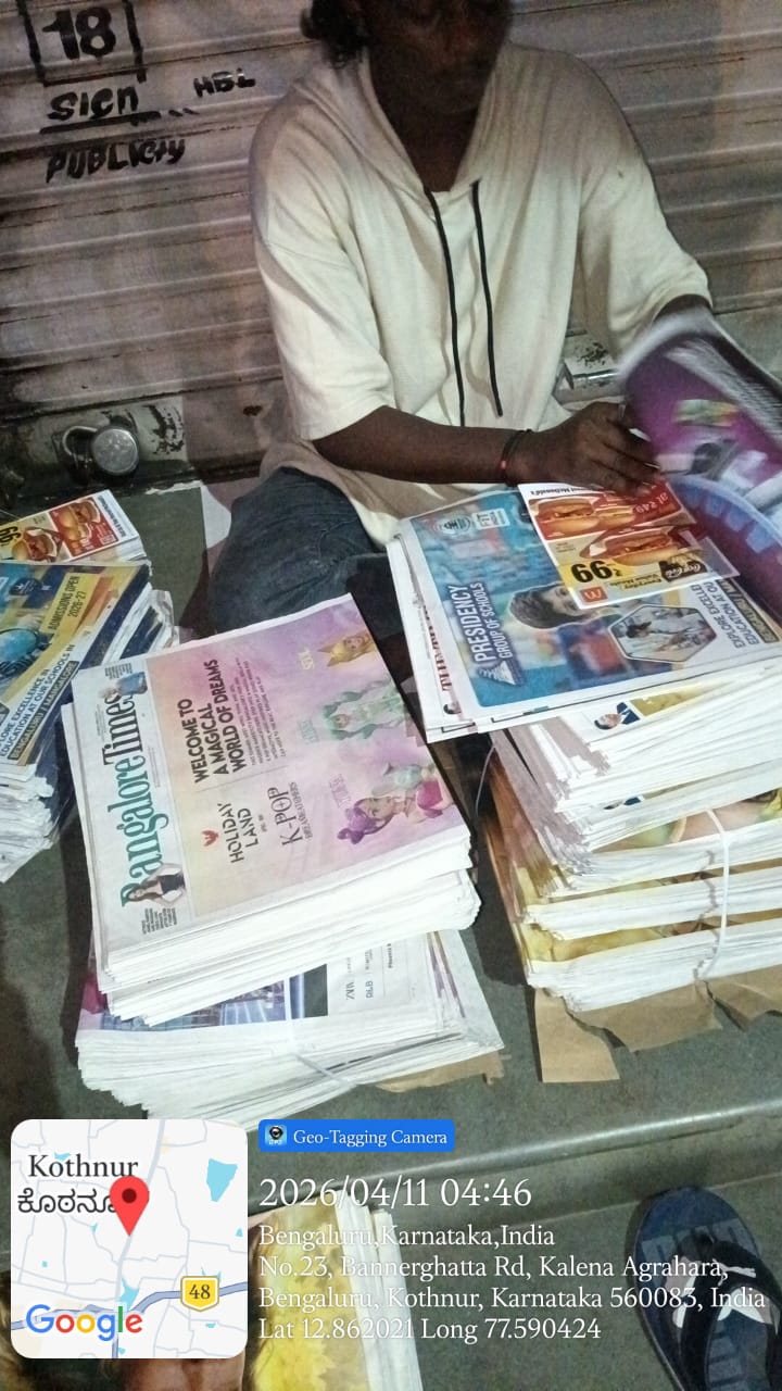 Indian newspaper with A4 pamphlet insert tucked into the centerfold showing 2026 advertiser rate card across Mumbai, Delhi, Bangalore