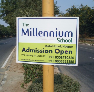 No parking board advertising — a branded board fixed to a house or society gate