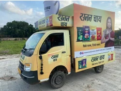 Mobile van advertising in Bangalore showing branded Tata Ace vehicle with LED display on MG Road during evening traffic with high visibility and engagement
