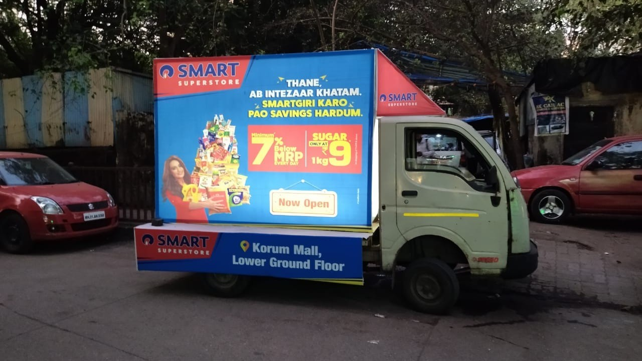 High-impact mobile advertising vans featuring LED screens and vinyl branding operating in Chennai and Coimbatore commercial zones.