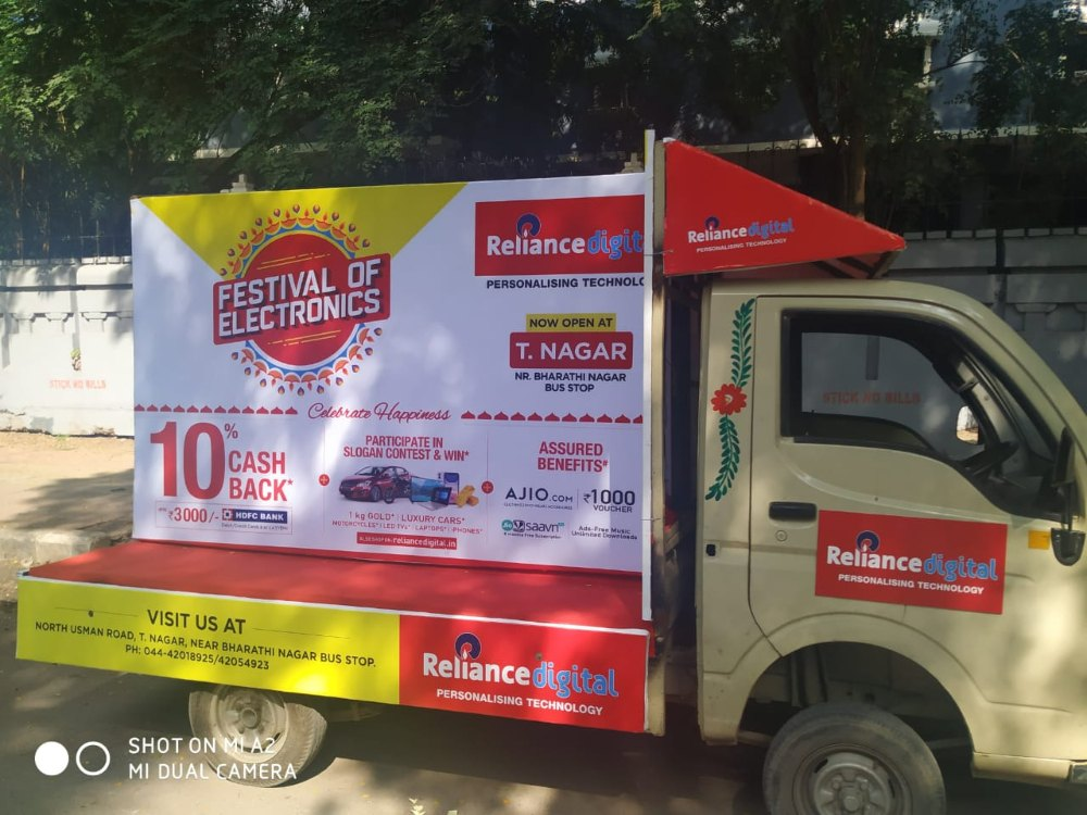 Branded mobile van advertising on Bangalore streets showcasing high visibility outdoor promotion